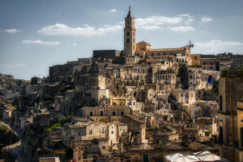 brown concrete buildings under the blue sky