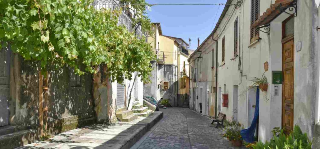A narrow street among the old houses of Aieta, a rural village in the Calabria region.